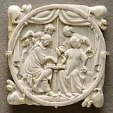 A couple playing chess, ivory mirror case c. 1300