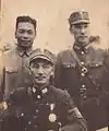 Chiang Kai-shek (front) with his sons Chiang Ching-kuo (rear, left) and Chiang Wei-kuo (rear, right)