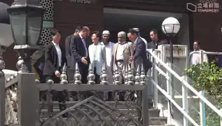 Carrie Lam (fourth from left) seen with mosque representatives leaving the premises the next day