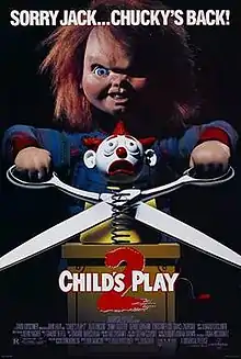 Chucky, seen in a Good Guy Doll, prepares to cut a metal coil attached to a jack-in-a-box, with a head of a clown showing a scared emotion. The film's tagline reads "SORRY JACK...CHUCKY'S BACK!"