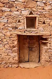 Massive hand hewn door cut from acacia trees