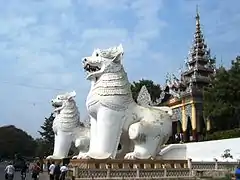 Two giant chinthes guard the southern approach to Mandalay Hill