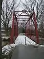 The only Pratt through truss bridge remaining in Kosciusko County. One of the few surviving spans built by the Bellefontaine Bridge and Iron Company.