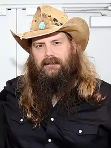 A bust shot of country music singer Chris Stapleton.