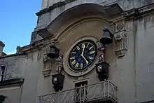 Clock with two painted figures