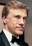 Christoph Waltz wearing a suit and a bowtie in 2012.