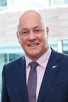 Smiling bald white man in suit