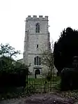 A stone tower with a battlemented parapet