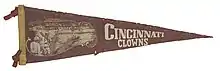 Maroon and gold pennant with the Cincinnati Clowns Logo.