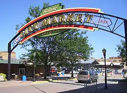 A City Market farmers' market entrance is at Walnut Street & West 5th Street