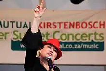 Johnston on-stage for a Mango Groove concert at Kirstenbosch National Botanical Garden on 1 January 2012