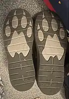 A pair of boys school shoes from Clarks'. The soles are supposed to represent bear paw prints.