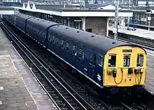 Class 501 train in Rail Blue calls at Harrow and Wealdstone