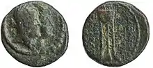 A coin depicting a queen and a king. The queen's portrait is in the front.