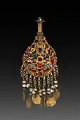 Earring with Vishnu riding Garuda; circa 1600; gold set with jewels and semi-precious stones; overall: 2.6 cm; from Nepal; Cleveland Museum of Art (Cleveland)