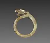 Fluted ring with a dragon head (huan); circa 475 BC; jade (nephrite); overall: 9.1 cm; Cleveland Museum of Art (Cleveland)