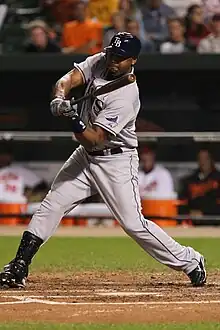 A man in a gray baseball uniform