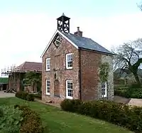 Coachman's House and Clock Tower Approximately 20 Metres East of Hudscott House