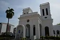 The half-capsule-shaped Shrine of Our Lady of Fatima in front and the 2018 extension on the left