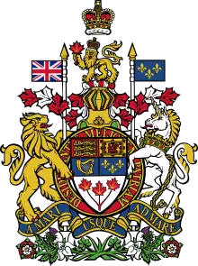 At the top there is a rendition of St. Edward's Crown, with the crest of a crowned gold lion standing on a twisted wreath of red and white silk and holding a maple leaf in its right paw underneath. The lion is standing on top of a helm, which is above the escutcheon, ribbon, motto, and compartment. There is a supporter on either side of the escutcheon and ribbon; an English lion on the left and a Scottish unicorn on the right.
