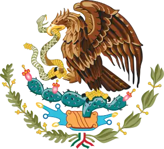Coat of arms image with large brown bird in center, holding a snake in its beak, and standing on a cactus with leaves and ribbons below