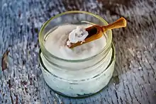 Coconut oil on a wooden spoon