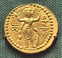 Three-faced Oesho, often identified with Shiva, on a coin of Huvishka.