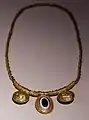 Gold necklace with bulle, 310-290 BC, from the tomb of gold in the necr. of the fishpond in todi