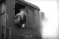 Driver in the cab of the steam locomotive NS 3413. (Between 1925 and 1935)