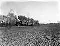 A steam locomotive from the series 3400 of the N.S. with an oil train near Dalfsen. (1951)