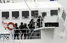 Commando Jaubert boarding the Alcyon, relying on techniques of combat in confined environment.