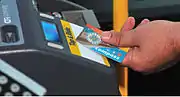 A Compass Card being tapped on an integrated farebox validator