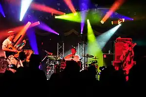 Marin, left, Mann, center, and Ferrara, right, performing live in 2015