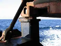 Twistlock engaged with shipping container at sea
