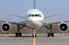 Forward view of aircraft, showing fuselage profile, two circular engines