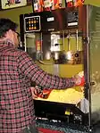 Popcorn being served in Coolidge Corner Theatre lobby