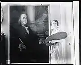 Photograph of Countess Maria Zichy beside a portrait of Benjamin Franklin
