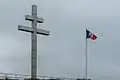 Cross of Lorraine and Free French flag, Courseulles-sur-Mer, Calvados, Normandy, where De Gaulle landed on 14 June 1944.