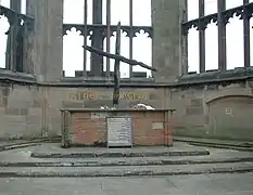 A wooden cross at Coventry Cathedral, constructed of the remnants of beams found after the Coventry Blitz