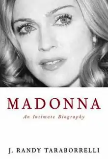 Image of a blond, middle-aged woman in greyscale, on a white background. She has bright eyes, and looks upwards towards the left of the image. Beneath her image, the title "Madonna" is written in red capital letters, followed by "An Intimate Biography" below it. Further down, the words "J. Randy Taraborrelli" is written in black.