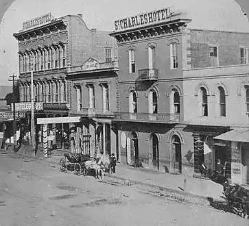 At far right, "L. Harris" sign is visible, when Harris' Quincy Hall store was located at 54 N. Main St. (old numbering, loc. approx. 308 N. Main today), c.1878