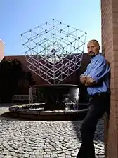 Hans Godo Frabel in front of his Large Cube with Imploding Glass Spheres Atlanta Botanical Garden, 2007.