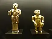 Two statues caciques sitting on stools; Museum of the Americas (Madrid, Spain)