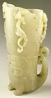 Chinese cup (Guang) in the form of a rhyton with dragons and scrollwork panel