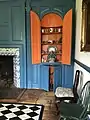 Dining room fireplace and built-in cupboard