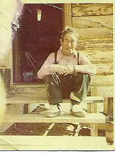 Sam Phillips (Yup'ik) wearing his favorite mukluks, Chuathbaluk, Alaskaca. 1970