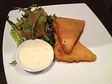 Image 54Fried cheese, served with tartar sauce and side salad (from Czech cuisine)