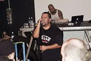 MC dälek (front) and Oktopus (back) performing at the Leoncavallo cultural center in Milan in 2008
