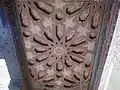 A restored painted wooden ceiling under one of the courtyard galleries