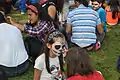 Girl has face painted in Mexico City, celebrating Day of the Dead, 2014.